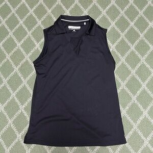 Ladies performance top with pretty scalloped neck.